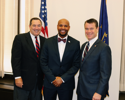 Dr. Jerome Adams picture with Senator Donnelly